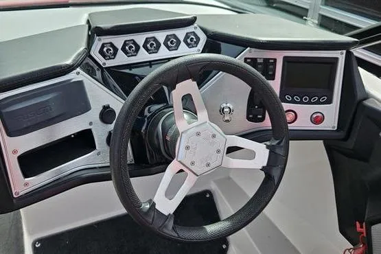 Slide: The Image of 2017 MasterCraft NXT20 boat dashboard with steering wheel and control panel. - 5