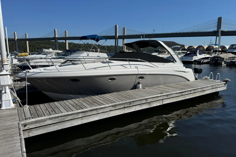 The Image of 2007 Chaparral Signature 330 boat docked at marina with bridge in background. - 0