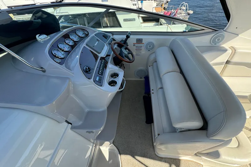Slide: The Image of 2007 Chaparral Signature 330 boat interior with helm, gauges, and seating. - 13