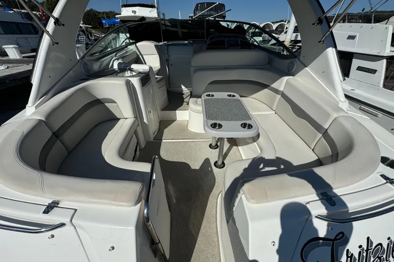 Slide: The Image of 2007 Chaparral Signature 330 boat interior with spacious seating and table setup. - 17