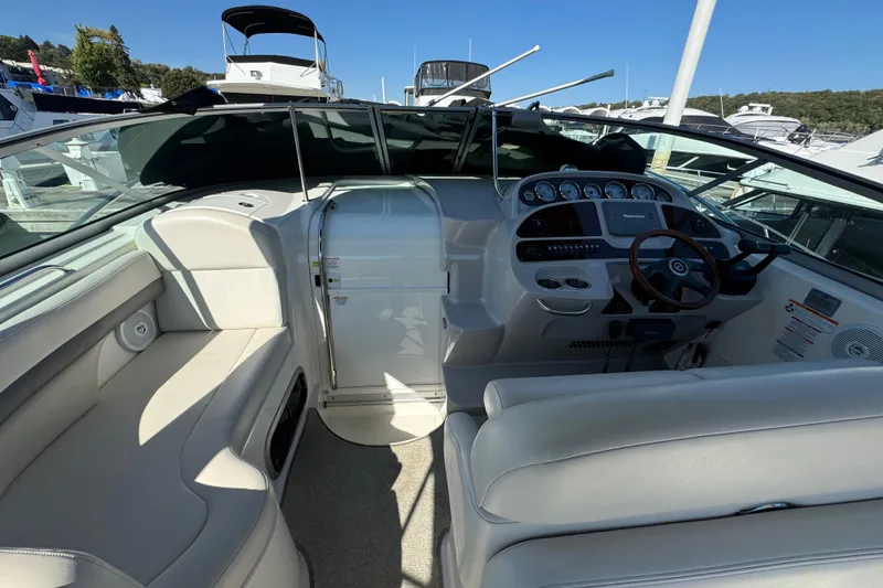 Slide: The Image of 2007 Chaparral Signature 330 boat interior with steering wheel and dashboard controls. - 19