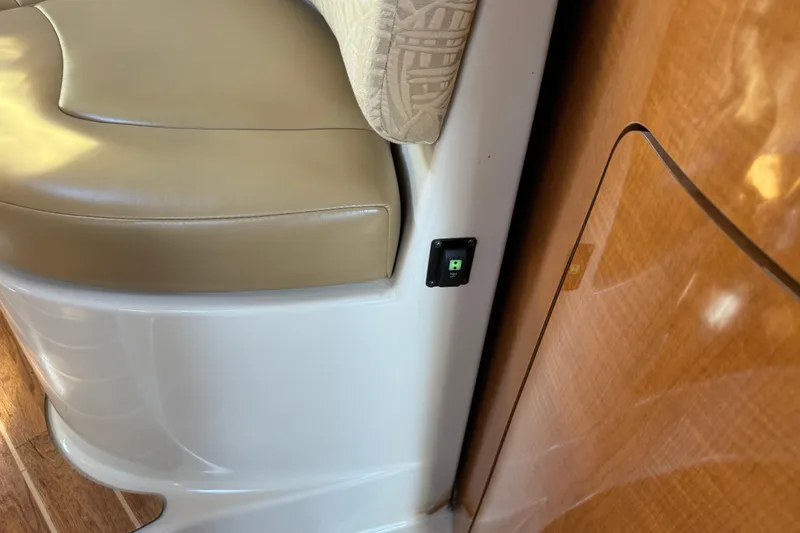 Slide: The Image of 2007 Chaparral Signature 330 interior with beige seating and wood paneling. - 28