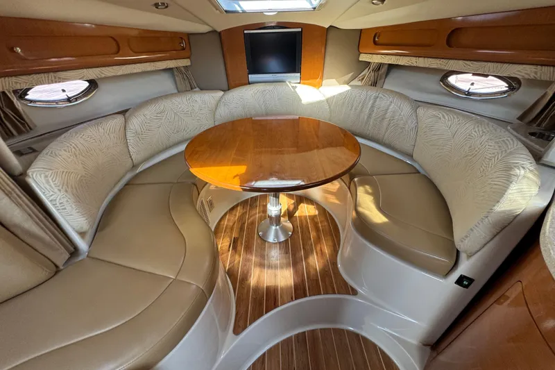 Slide: The Image of 2007 Chaparral Signature 330 interior with elegant seating and wooden table. - 29
