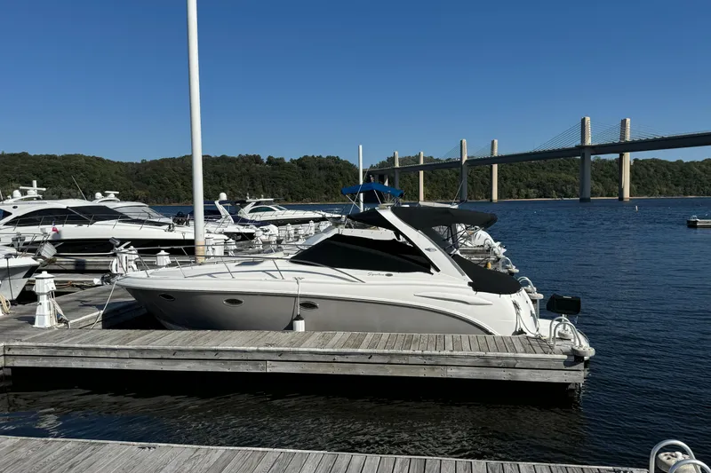 Slide: The Image of 2007 Chaparral Signature 330 yacht docked at marina with bridge in background. - 3