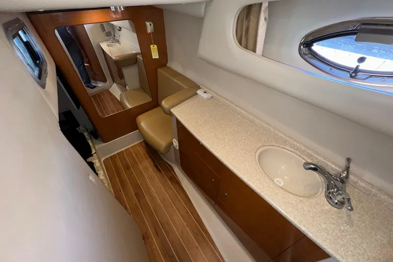 Slide: The Image of 2007 Chaparral Signature 330 interior with sink, mirror, and wooden flooring. - 33