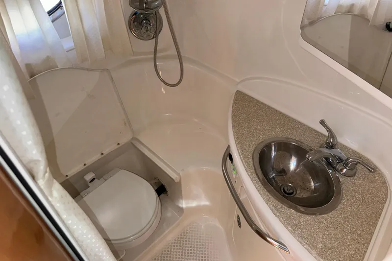 Slide: The Image of 2007 Chaparral Signature 330 bathroom with sink, toilet, and showerhead. - 34