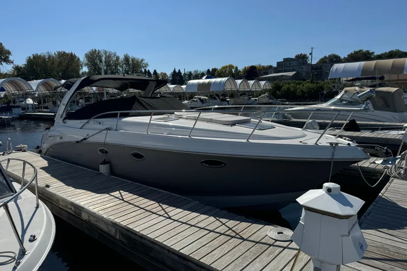 Slide: The Image of 2007 Chaparral Signature 330 boat docked at a marina under clear skies. - 5
