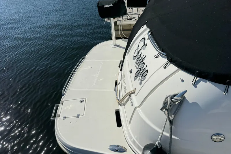 Slide: The Image of 2007 Chaparral Signature 330 boat with black cover on water. - 6