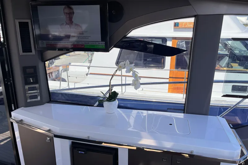 Slide: The Image of Interior of 2024 Galeon 425 HTS yacht with TV and elegant counter. - 12