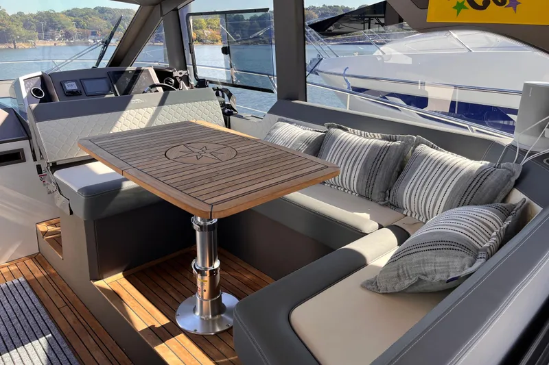 Slide: The Image of Luxurious interior of 2024 Galeon 425 HTS yacht with elegant seating and wooden table. - 14
