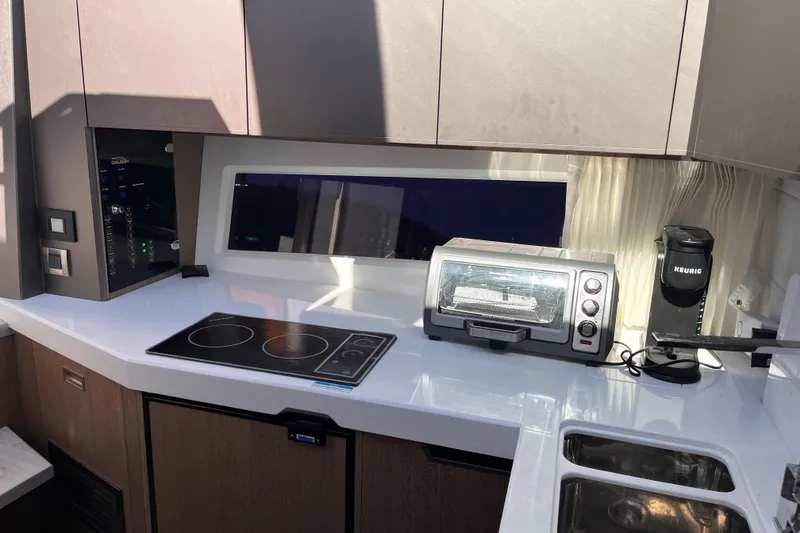 Slide: The Image of Modern kitchen interior of 2024 Galeon 425 HTS yacht with appliances and sleek design. - 20