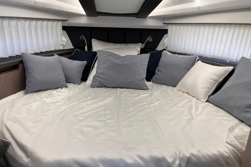 Slide: The Image of Luxurious bedroom interior of 2024 Galeon 425 HTS yacht with plush pillows and elegant bedding. - 22