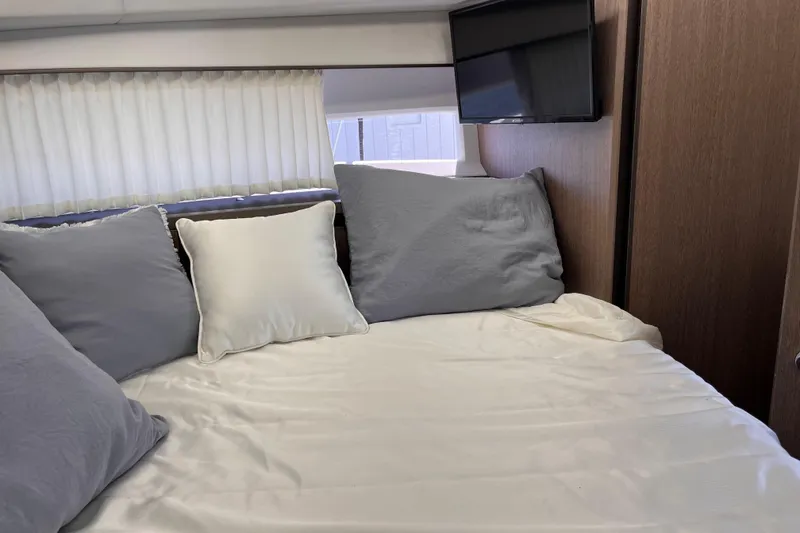 Slide: The Image of Cozy cabin interior of 2024 Galeon 425 HTS yacht with bed and TV. - 23