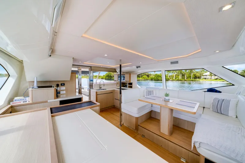 Slide: The Image of Luxurious interior of 2019 Aquila 44 Yacht with modern furnishings and panoramic windows. - 10