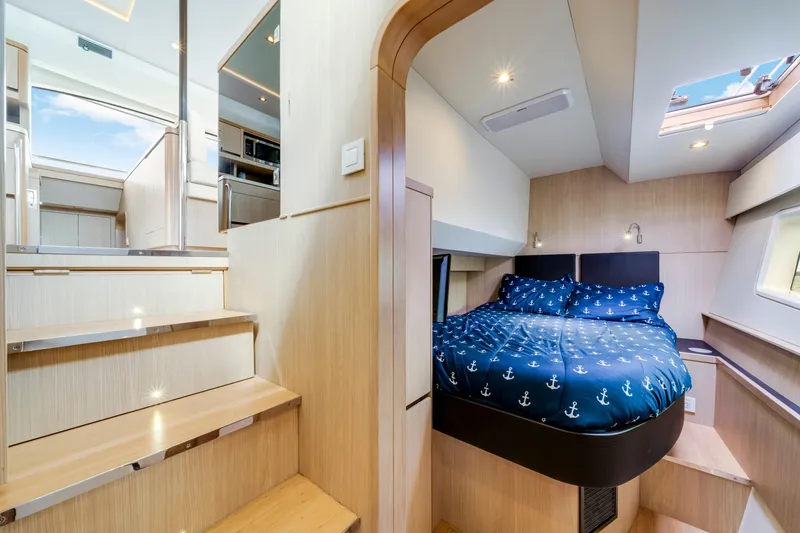 Slide: The Image of Luxurious bathroom on 2019 Aquila 44 Yacht with shower, sink, and window view. - 26