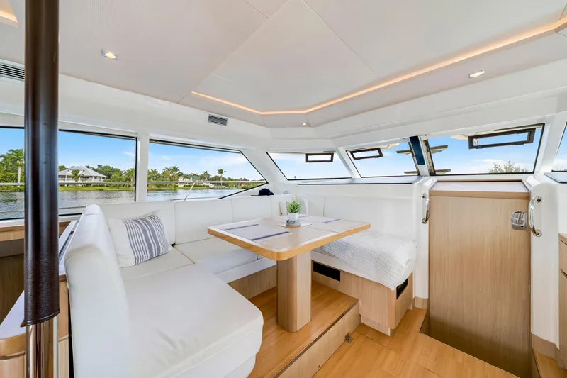 Slide: The Image of Interior of 2019 Aquila 44 Yacht, featuring modern design and panoramic windows. - 3