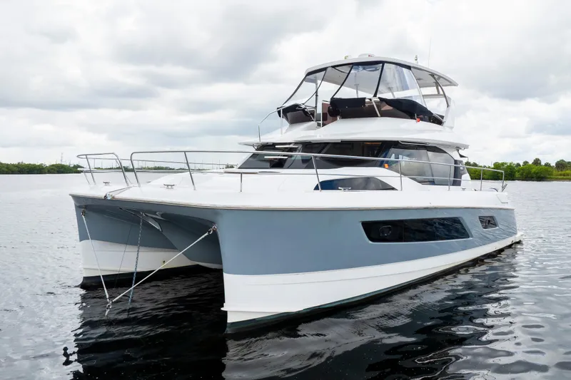 Slide: The Image of 2019 Aquila 44 Yacht on calm water, showcasing sleek design and modern features. - 60