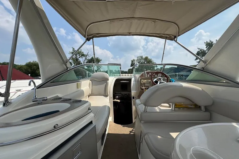 Slide: The Image of 2006 Larson Cabrio 274 boat bathroom with sink and toilet. - 2