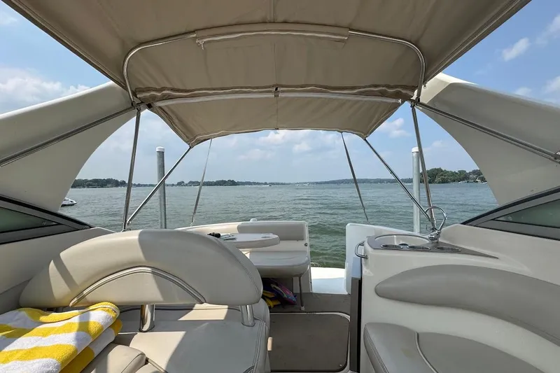 Slide: The Image of 2006 Larson Cabrio 274 cabin interior with kitchenette and seating area. - 3