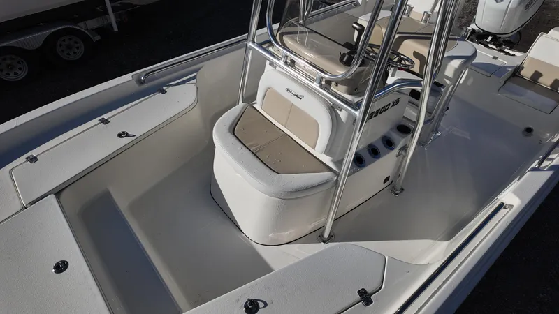 Slide: The Image of 2025 Bulls Bay 2200XS boat interior with seating and console, showcasing modern design and functionality. - 12