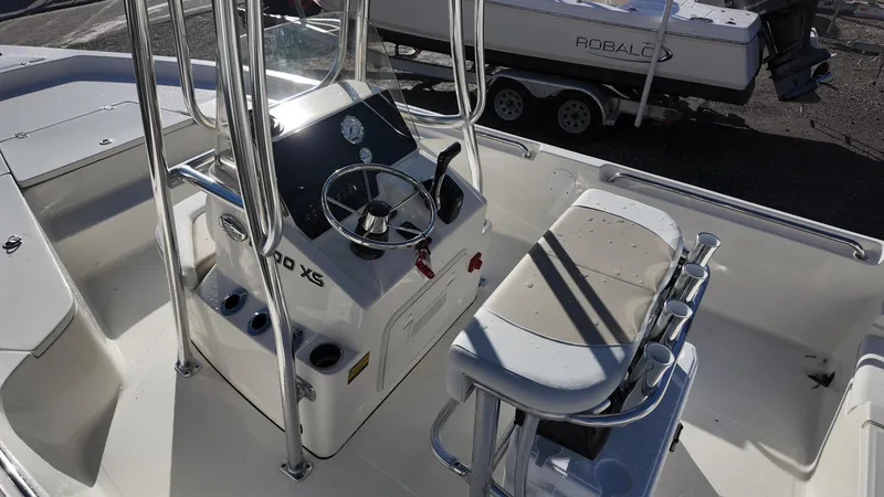 Slide: The Image of 2025 Bulls Bay 2200XS boat interior with steering console and seating. - 14
