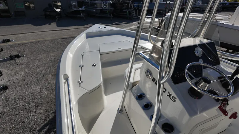 Slide: The Image of 2025 Bulls Bay 2200XS boat interior with steering console and seating. - 15