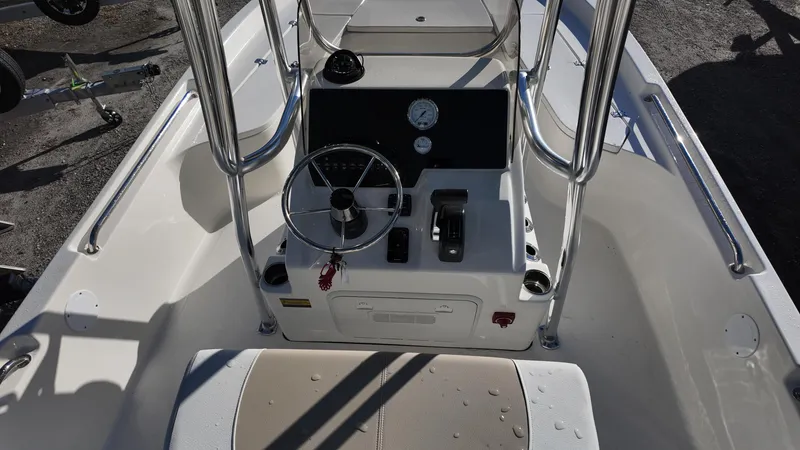 Slide: The Image of 2025 Bulls Bay 2200XS boat console with steering wheel and controls. - 17