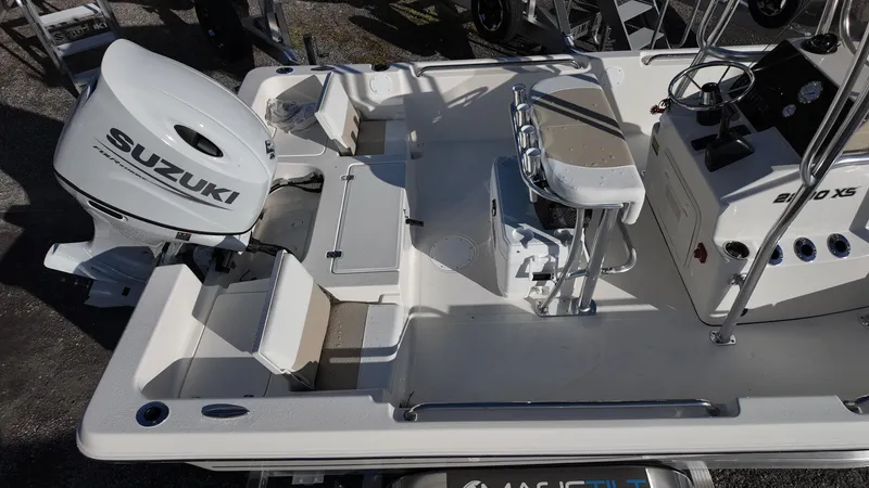 Slide: The Image of 2025 Bulls Bay 2200XS boat with Suzuki engine, featuring spacious deck and seating. - 7