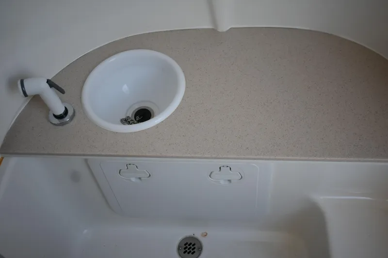 Slide: The Image of 2025 Sea Pro 245FLX Sandbar boat sink and countertop detail. - 11