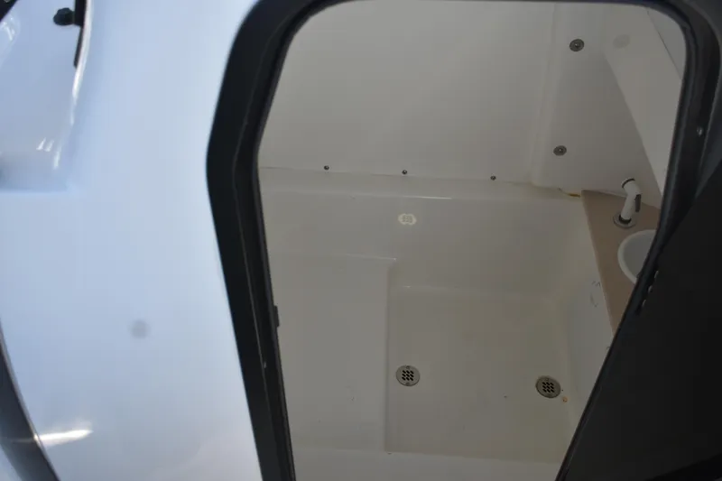 Slide: The Image of Interior view of 2025 Sea Pro 245FLX Sandbar boat's cabin area. - 12