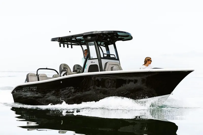Slide: The Image of Manufacturer Provided Image: 2025 Sea Pro 245FLX Sandbar boat cruising on water, side view. - 18