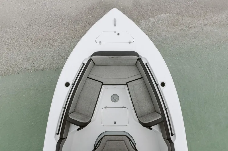 Slide: The Image of Manufacturer Provided Image: 2025 Sea Pro 245FLX Sandbar boat, top view of bow seating area on calm water. - 20