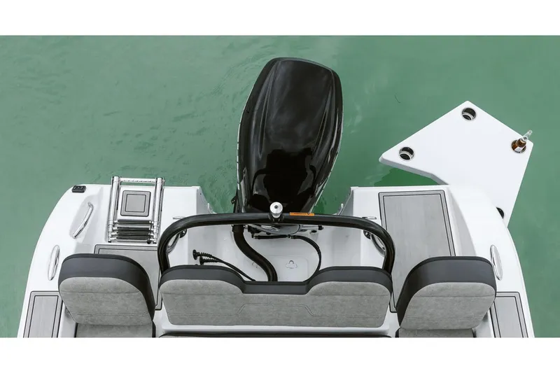 Slide: The Image of Manufacturer Provided Image: 2025 Sea Pro 245FLX Sandbar boat, rear view with motor and seating, on water. - 23