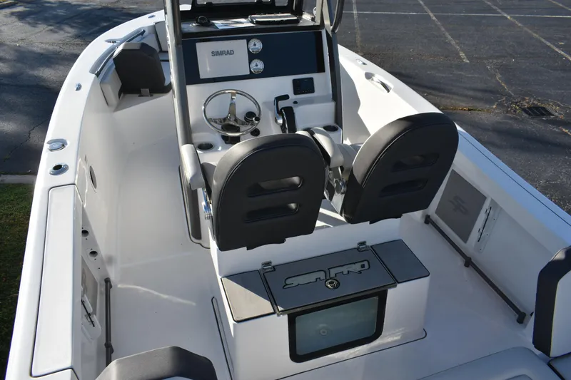 Slide: The Image of 2025 Sea Pro 245FLX Sandbar boat interior with dual seats and Simrad console. - 5