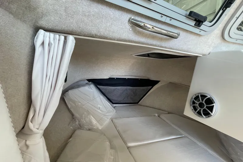 Slide: The Image of Interior cabin of 2026 Parker 217 Explorer boat with speaker and window. - 16