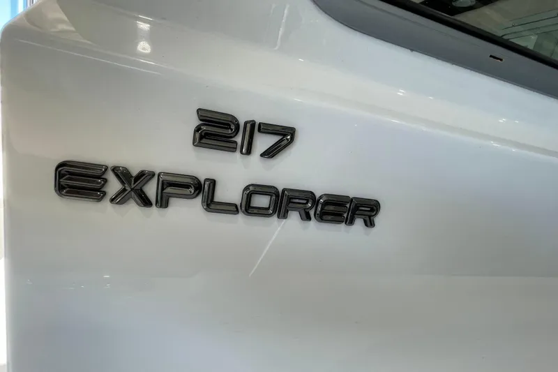 Slide: The Image of Close-up of 2026 Parker 217 Explorer model name on white surface. - 19