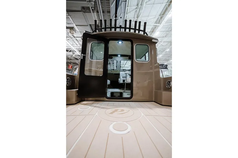 Slide: The Image of Manufacturer Provided Image: 2026 Parker 217 Explorer boat cruising on calm waters. - 4