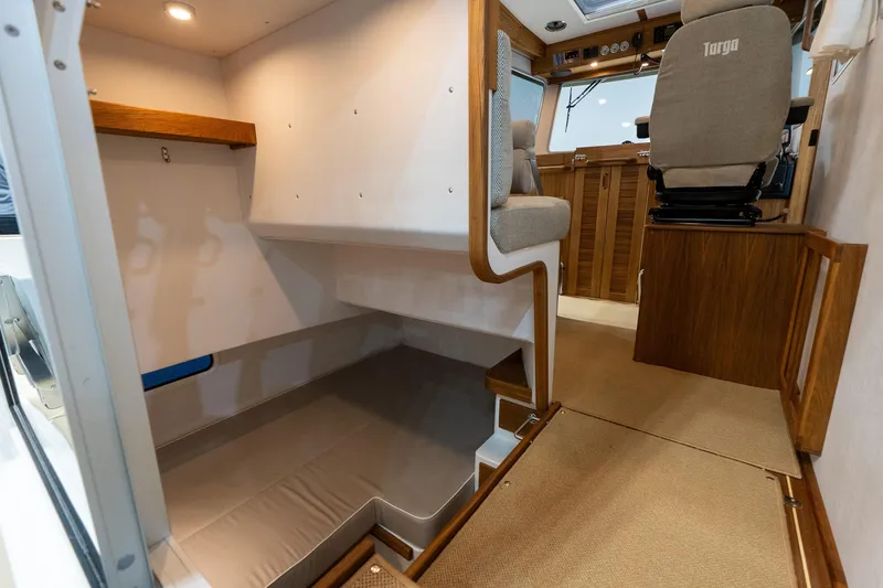 Slide: The Image of 2026 Targa 27.2 boat cruising at sunset on open water. - 16