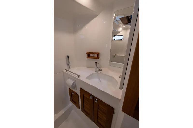 Slide: The Image of 2026 Targa 27.2 boat docked by the water, showcasing sleek design and branding. - 22