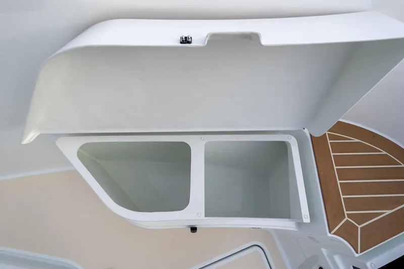 Slide: The Image of Open storage compartment on 2026 Targa 27.2 boat, featuring a sleek white design. - 28
