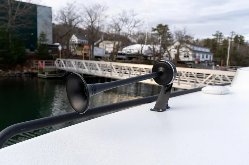 Slide: The Image of 2026 Targa 27.2 boat horn on deck near marina. - 36