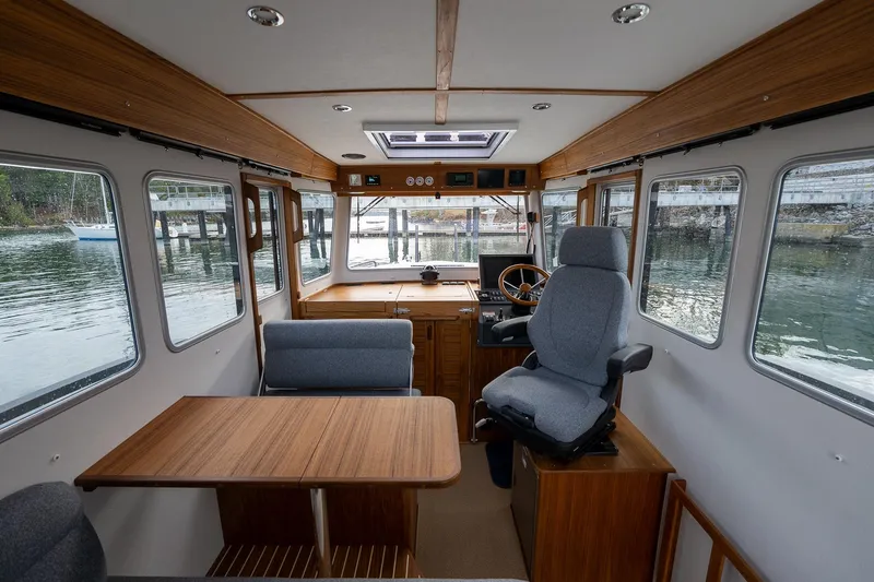 Slide: The Image of Interior of 2026 Targa 27.2 boat with wooden furnishings and large windows. - 47