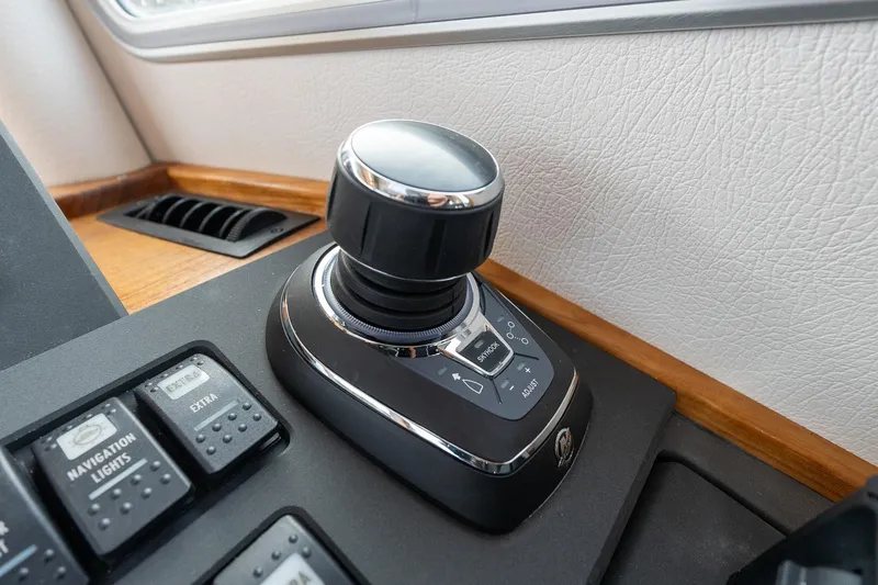 Slide: The Image of Control panel of 2026 Targa 27.2 boat with joystick and navigation buttons. - 52