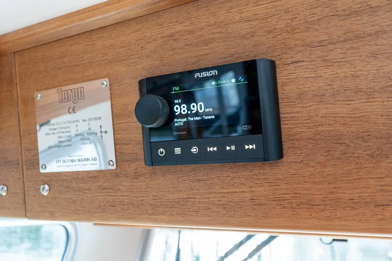 Slide: The Image of Fusion radio system on Targa 27.2 boat, 2026 model, with wooden interior panel. - 55