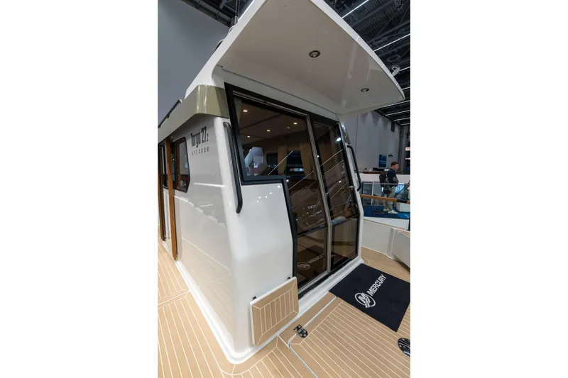 Slide: The Image of 2026 Targa 27.2 boat cruising on open water under cloudy skies. - 6