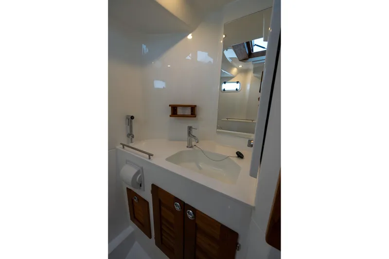 Slide: The Image of Modern bathroom in 2026 Targa 27.2 boat with sleek fixtures and wooden accents. - 61