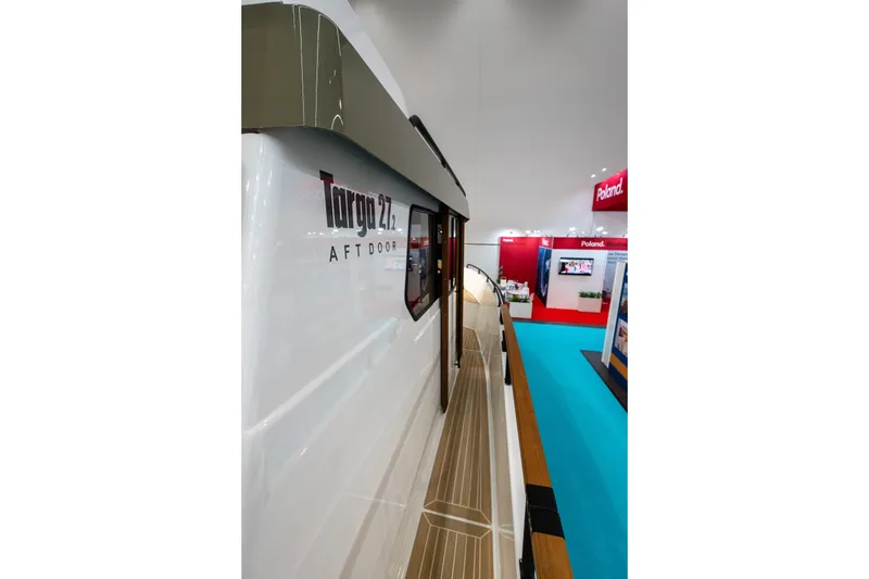 Slide: The Image of 2026 Targa 27.2 boat cruising on open water, rear view. - 7