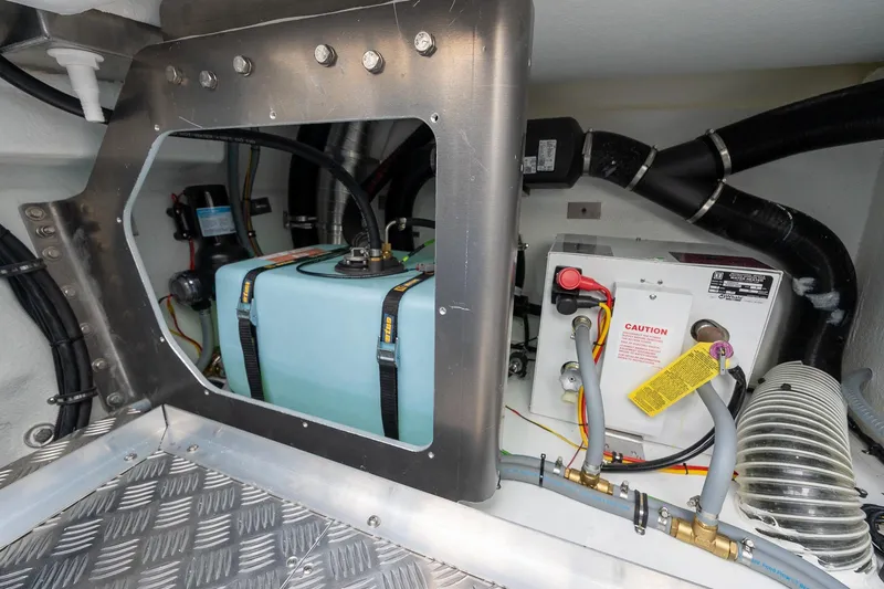 Slide: The Image of Engine compartment of 2026 Targa 27.2 boat with fuel tank and electrical components. - 86