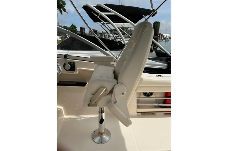 Slide: The Image of Captain's chair on 2019 Grady-White Freedom 235 boat, featuring sleek design and comfortable seating. - 13