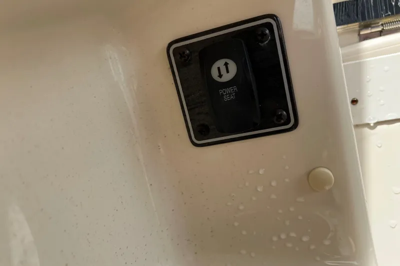 Slide: The Image of Power seat control on 2019 Grady-White Freedom 235 boat interior. - 15